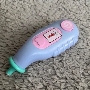 This item is a toy thermometer from a children's medical or vet pretend play set